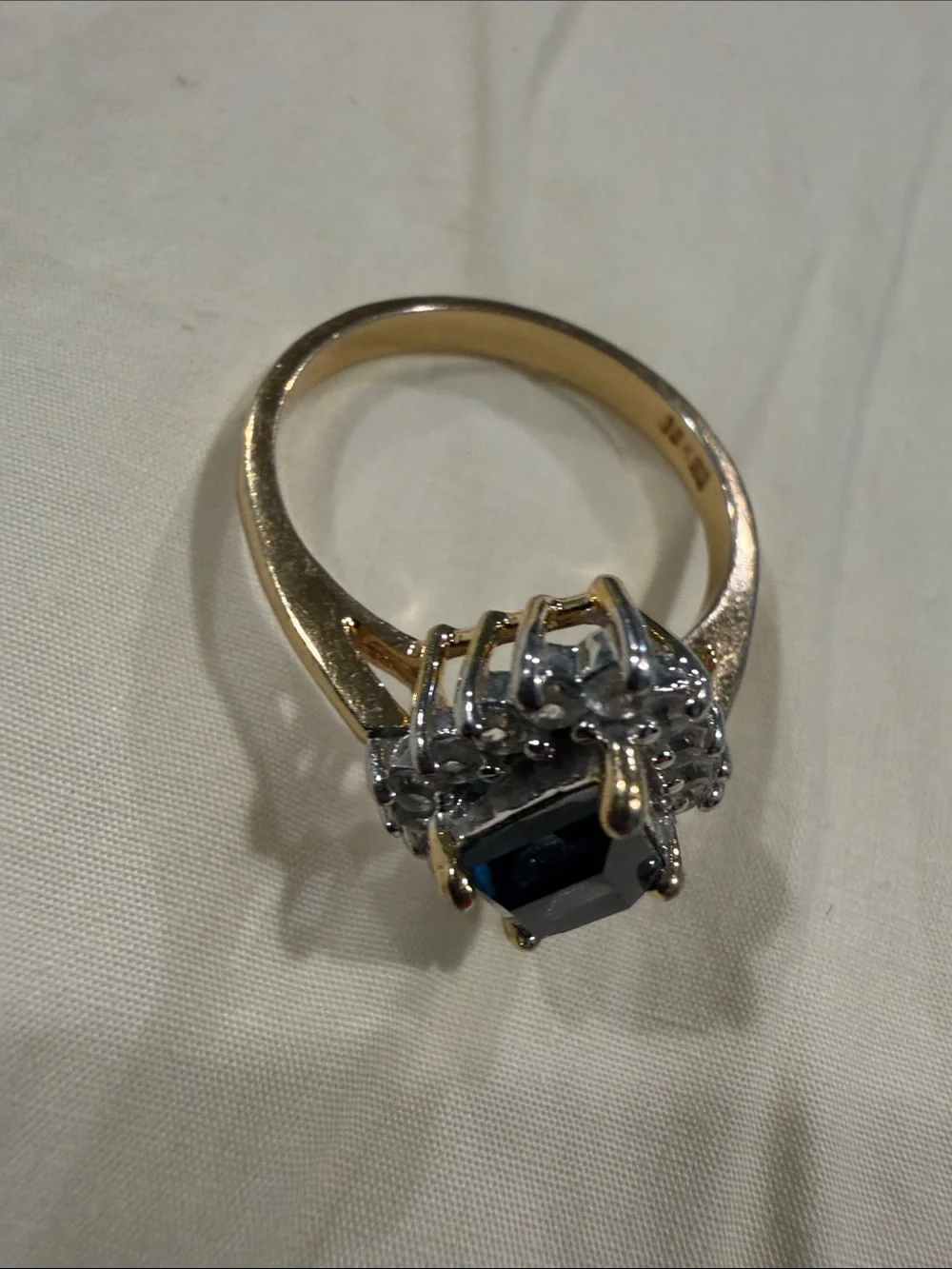 18K Gold Electroplated Ring with Deep Blue Kite-Cut Center and Clear Stones.
